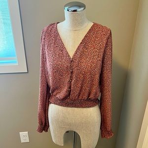 Hem and thread pink leopard blouse
